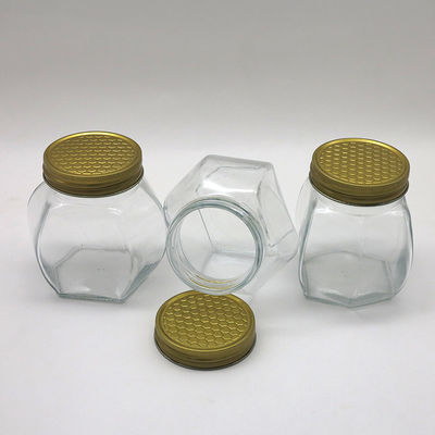 Tarro hermético seguro de la miel de la comida transparente, tarros del vidrio del hexágono de la miel del almacenamiento proveedor