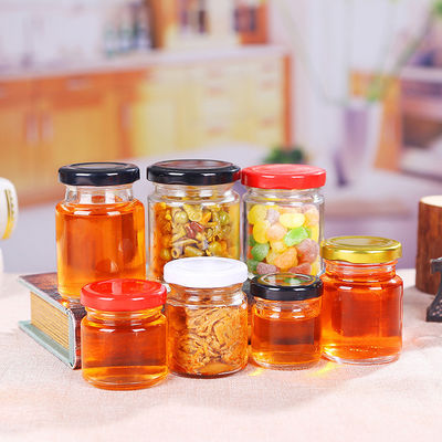 Tarro de cristal de la miel de la etiqueta sin plomo del sello con forma redonda de la categoría alimenticia de la tapa de la lata proveedor