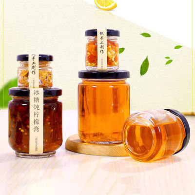 Tarro de cristal transparente seguro de la miel resistente a la corrosión para casarse favores proveedor