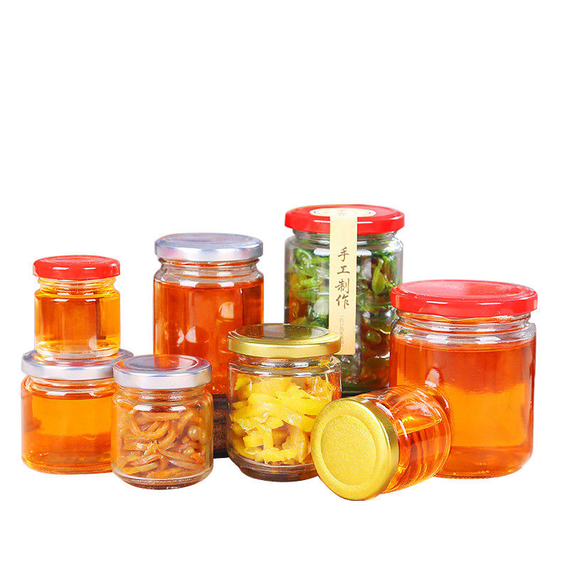 Tarro de cristal de la miel de la etiqueta sin plomo del sello con forma redonda de la categoría alimenticia de la tapa de la lata proveedor