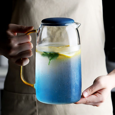 Sistema de cristal coloreado de la jarra del agua 1550ml con 2 tazas para la bebida helada del agua proveedor