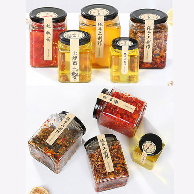 Tarros de cristal formados cuadrado del almacenamiento de la comida con el material del vidrio de la soda del casquillo del metal del tornillo proveedor