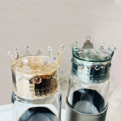 Botella de agua de cristal a prueba de calor 300ml con la tapa de la corona proveedor