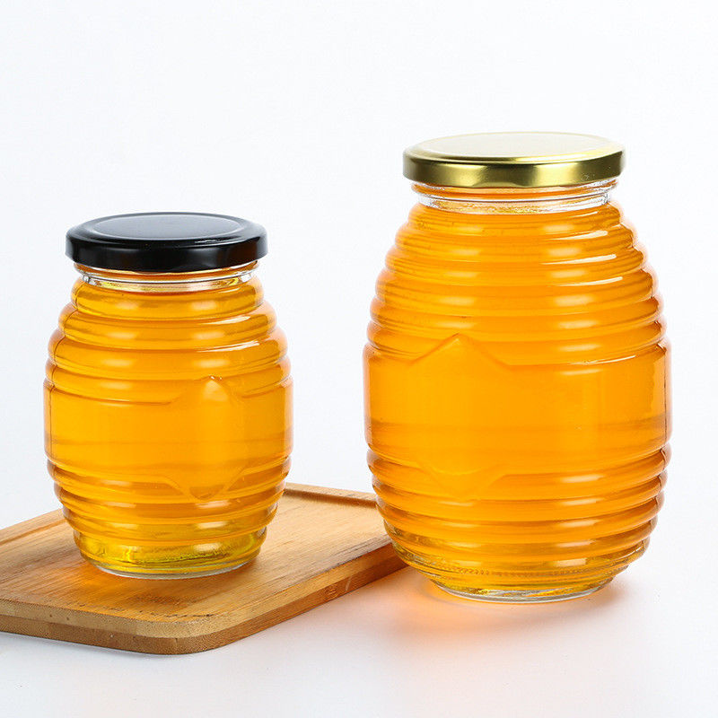 La forma de la abeja pocos tarros del vidrio, desea roscado alrededor del tarro de cristal con la tapa proveedor